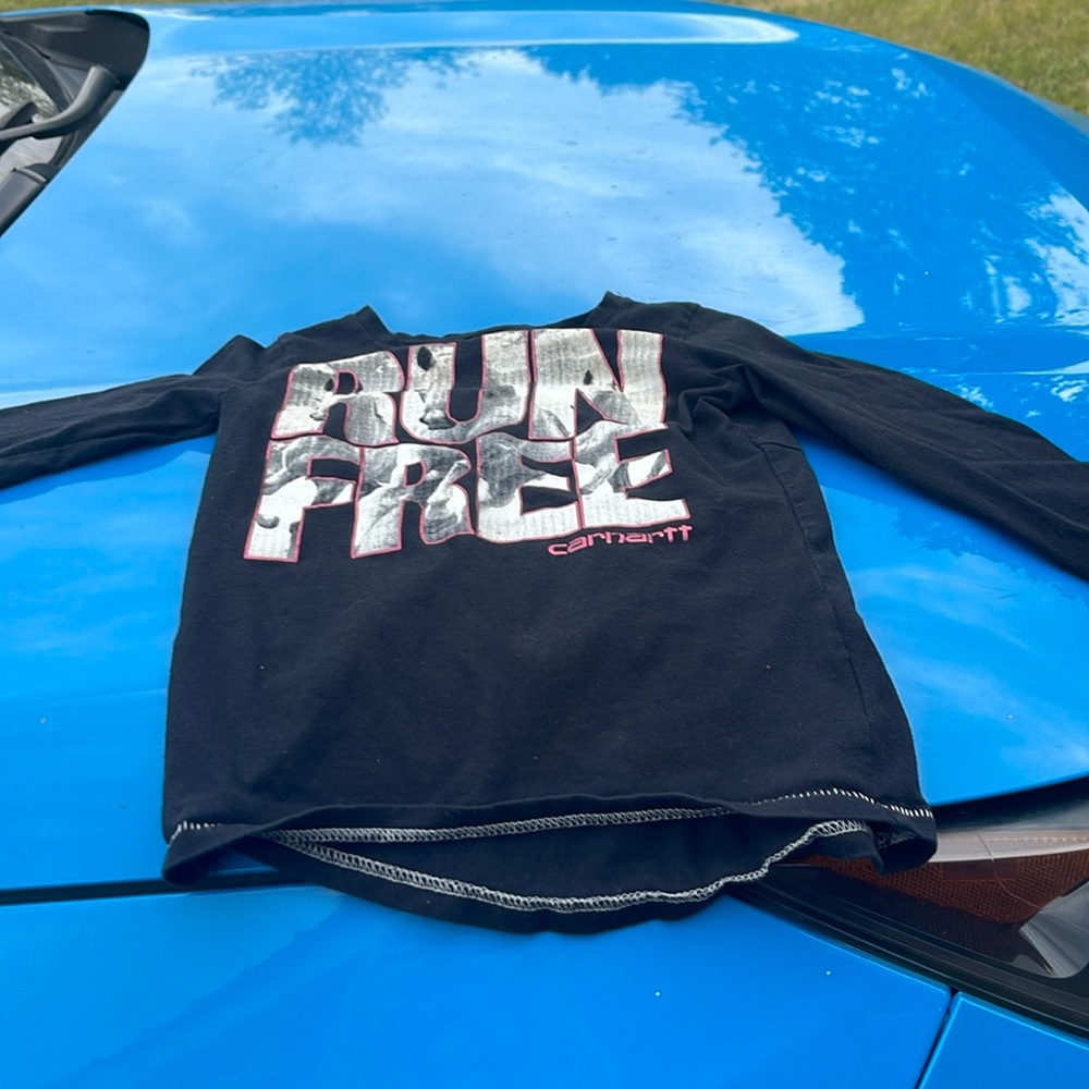 It says run free with horses in run free real cute for the horse lover !